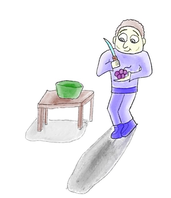 osoba obierająca winogrona ze skórki nożem